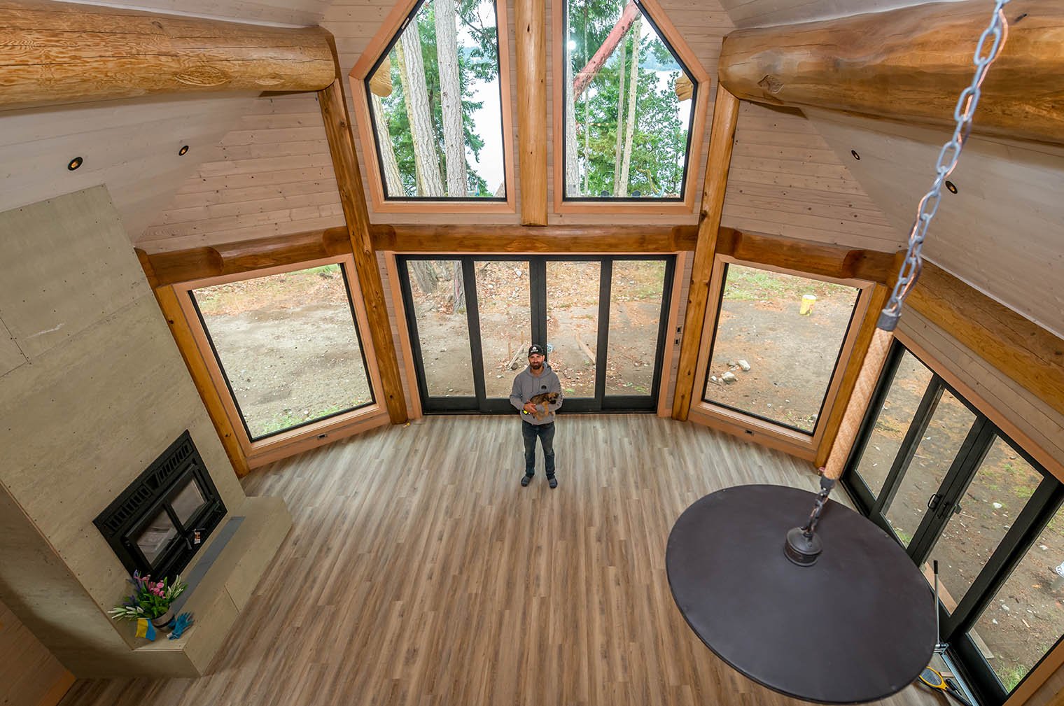 Open Living Space with Grand Fireplace and Exposed Timber
